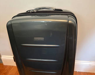 Lot 60: Gray Samsonite hard-shell rolling suitcase with TSA lock