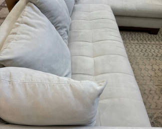 Lot 10: Light gray sectional sofa with chaise and cushions