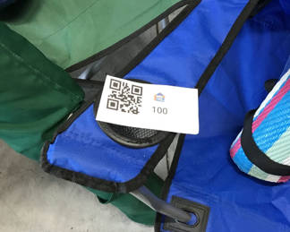 Lot 100: Blue Folding Camping Chair with Rolled Mats