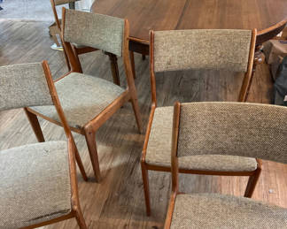 Lot 190: Round wooden dining table with upholstered chairs