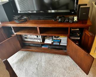 #009 Ashley Entertainment Center - 60x19x29 - w/4 doors and 2 open shelves $150.00