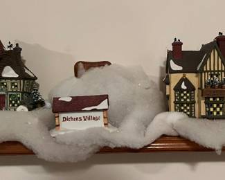 Large collection of Department 56 Dickens Village houses and accessories.