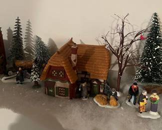 Large collection of Department 56 Dickens Village houses and accessories.
