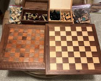 Four sets of chest pieces and two chess boards.