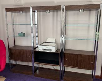 #23 - $1,450 - 1970's Three sectional walnut modular etagere designed by Milo Baughman with recessed lights 