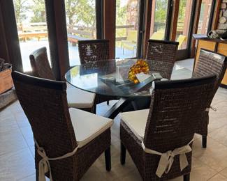 #9 -$400 -Round glass top table 54"x54" round with wood base  - slight damage on one leg & #10 - $450 -Set of 6 wicker cushion chairs 