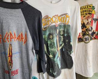 collection of vintage rock band T-shirts, including designs from Iron Maiden, AC/DC, and Anthrax