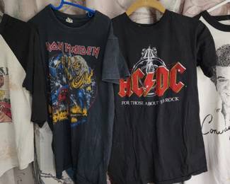 collection of vintage rock band T-shirts, including designs from Iron Maiden, AC/DC, and Anthrax