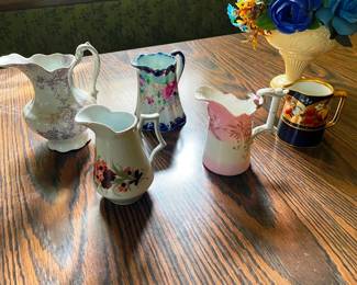 A large collection of antique pitchers!