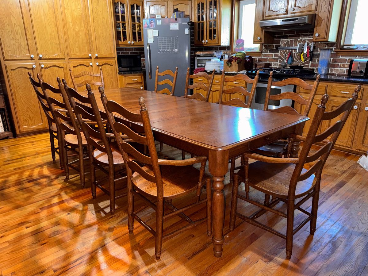 Solid hard maple wood, Martin's hand-crafted shaker style kitchen table with 4 leaves & 10 captain's ladder-back chairs with traditional turned legs. (2 chairs need repair.) Very sturdy and in very good condition. Approx. 109 x 42" with all 12" leaves. $1500