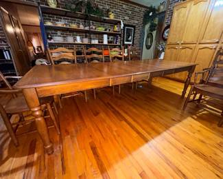 Solid hard maple wood, Martin's hand-crafted shaker style kitchen table with 4 leaves & 10 captain's ladder-back chairs with traditional turned legs. (2 chairs need repair.) Very sturdy and in very good condition. Approx. 109 x 42" with all 12" leaves. $1500