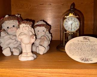 Larger Vintage 1990's  Dreamsicles cherub angel figurines.  $5 each. Legend of the Dogwood wooden plaque. $6. Right- Acrylic Angel verse desk frame. $6. Back- Vintage anniversary clock under glass dome, with key. AS-IS. $15