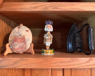 Small decorative plate on stand, Mardi Gras bobblehead and cast-iron sad iron. $10 each