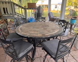 7-Piece outdoor tile-top patio dining set. Bar Height Round Table with 6 chairs. $125. 