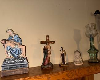 Pieta/"Our Sorrowful Mother" Statue. $30. Crucifixion Scene with the Virgin Mary. $20. Saint Therese of Lisieux/"The Little Flower". $12. Virgin Mary Bust. $10. Vintage Green Glass Hurricane Oil Lamp. $25.