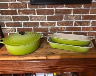 Le Creuset enameled, Cast Iron ("Kiwi" lime green, gradient) Oval Dutch Oven with Lid. Discontinued Color. $150. Le Creuset Kiwi Green enameled cast iron roasting dishes- #36 Oval Gratin Baker. 3 Quarts.  $75.00. #40 Rectangular Roaster. 5.25 Quarts. $125. 