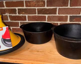  Left to Right: Le Creuset Moroccan Tagine (Yellow/Soleil gradient) $150. Lodge/USA 5-quart Dutch oven (no lid) $30. Antique 19th century bottom gate-marked primitive campfire or hearth cauldron. (no-lid) $50.