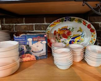 Left to Right: Vertex bowls, set of 3. $10. Great American Steakhouse Onion Machine. Boxed. $10. Large vintage oval enamelware fish platter. $20. Small Bouillon/Monkey Bowls. Entire 4 stacks sold as set. $25. 