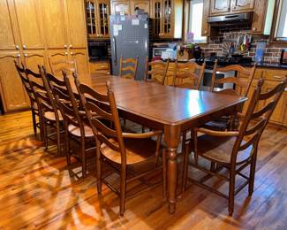 Solid hard maple wood, Martin's hand-crafted shaker style kitchen table with 4 leaves & 10 captain's ladder-back chairs with traditional turned legs. (2 chairs need repair.) Very sturdy and in very good condition. Approx. 109 x 42" with all 12" leaves. $1500