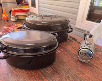 Left to Right; Black enamel oval roasting pan with domed lid, $15. Speckled black enamel oven roasting pan with domed lid. $20. Viking Professional Hand Mixer with beaters. $35.