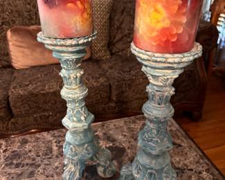 Vintage artisan floral pillar candles. One is cracked. Sold as a pair. $10