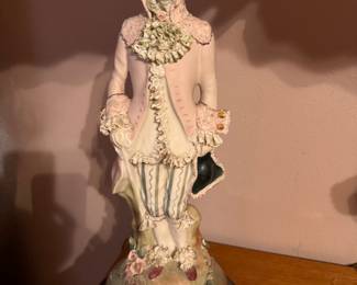 Pair of vintage MCM Italian porcelain figural table lamps features hand-painted 18th-century style aristocratic court or colonial couple figurines set on dark circular bases with scalloped fabric shades. Approx. 35h x 7" w base. $