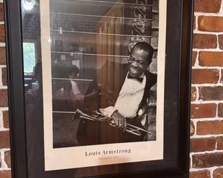 Framed black-and-white art print of jazz legend Louis Armstrong featuring candid photograph taken on the set of the classic 1956 musical film High Society.  $45