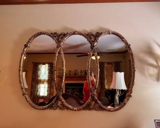 Vintage MCM style multi-oval Hollywood Regency triptych wall mirror by Burwood Products Co. or Syroco. Approx. 62w x 42 1/2h. $150.