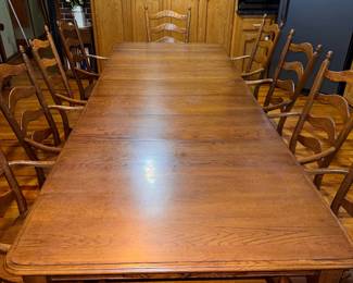 Solid hard maple wood, Martin's hand-crafted shaker style kitchen table with 4 leaves & 10 captain's ladder-back chairs with traditional turned legs. (2 chairs need repair.) Very sturdy and in very good condition. Approx. 109 x 42" with all 12" leaves. $1500