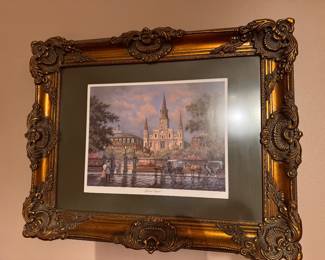 Framed lithograph print titled "Jackson Square" by Al Federico. Depicts the historic St. Louis Cathedral framed in a unique ornate gold frame. $85.00