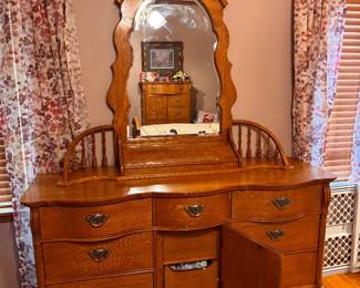 Solid Oak Lexington Furniture Victorian Sampler Collection Triple Dresser and matching Spindle Mirror. 9 drawers. Approx. 64w x 86 1/2 h x 21d. $600.