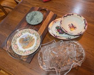 Johnson Brothers "His Majesty" Turkey plate. $10. Misc. clear Christmas serving trays. $10 each. Christmas dinnerware 2-piece set. $10. Green marble round trivet $10. Oblong wood cutting board. $15.