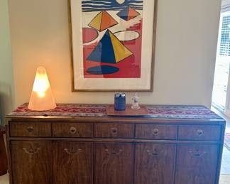 The Calder lithograph and console are sold.