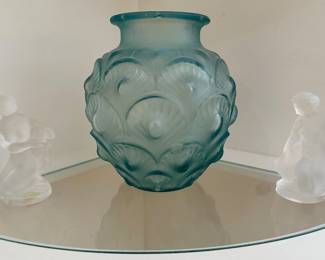Both Lalique crystal figurines are sold.