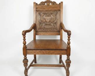 Lot #25 - Antique Carved Oak Armchair with Ornate Floral Design and Turned Legs