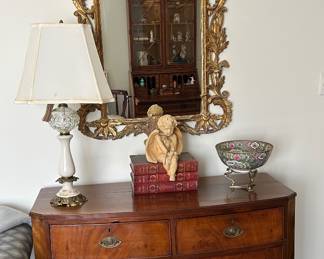 English bow front chest, carved gold leaf mirror 