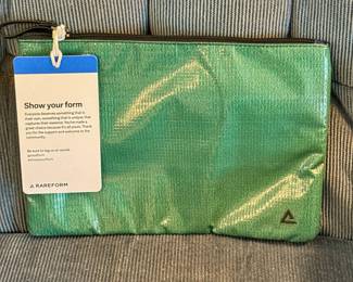 The Rareform Charlie Pouch is crafted from repurposed billboard vinyl, making each accessory completely unique.