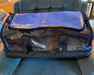 A Rareform Weekender Duffle Bag crafted from repurposed billboard material.