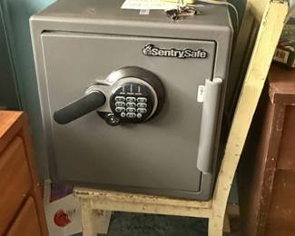 A heavy-duty SentrySafe digital fireproof and waterproof security safe featuring an electronic keypad and a lever handle.