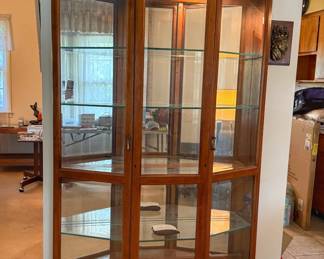 Traditional 3 section curio display cabinet.
