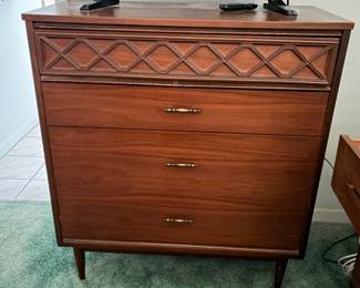 This is a vintage mid-century modern 4-drawer highboy dresser from the Bassett Furniture Tavern Collection