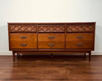 This is a vintage mid-century modern 9-drawer lowboy dresser from the Bassett Furniture Tavern Collection