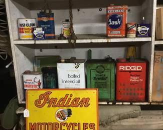 87.  Indian motorcycles, sign, and petroleum related cans