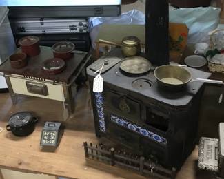 285.  Metal toy stoves