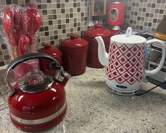 So many red accent pieces and functional kitchenware 