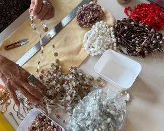 we took apart defective deadstock costume jewelry necklaces with super high quality beads and turned them into strands of beads to sell