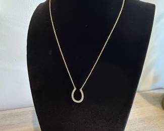 Gold Toned Horseshoe Pendant Necklace with Clear Stones