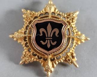 Lot 496 Gold tone and enamel fleurdelis 8 point star