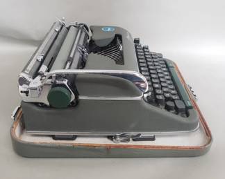 103 Lot 421 Vintage Olympia portable typewriter with hard case