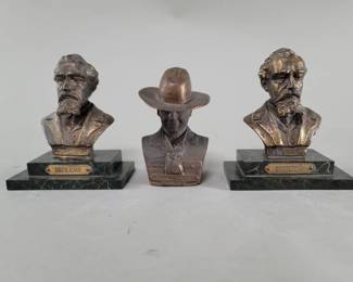 Lot 482 Pair of Dickens brass tone spelter bookends and
